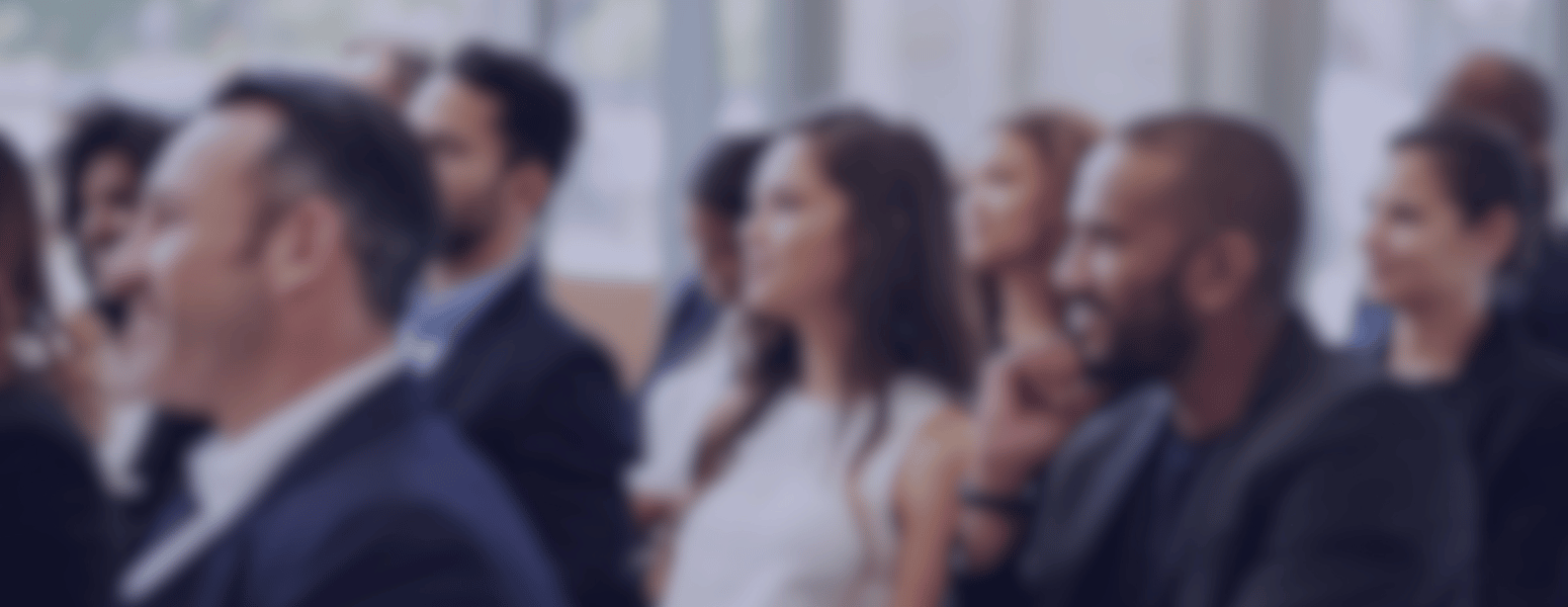 WhoAttendGlobalSummit_BlogImage Professionals listening to a conference session